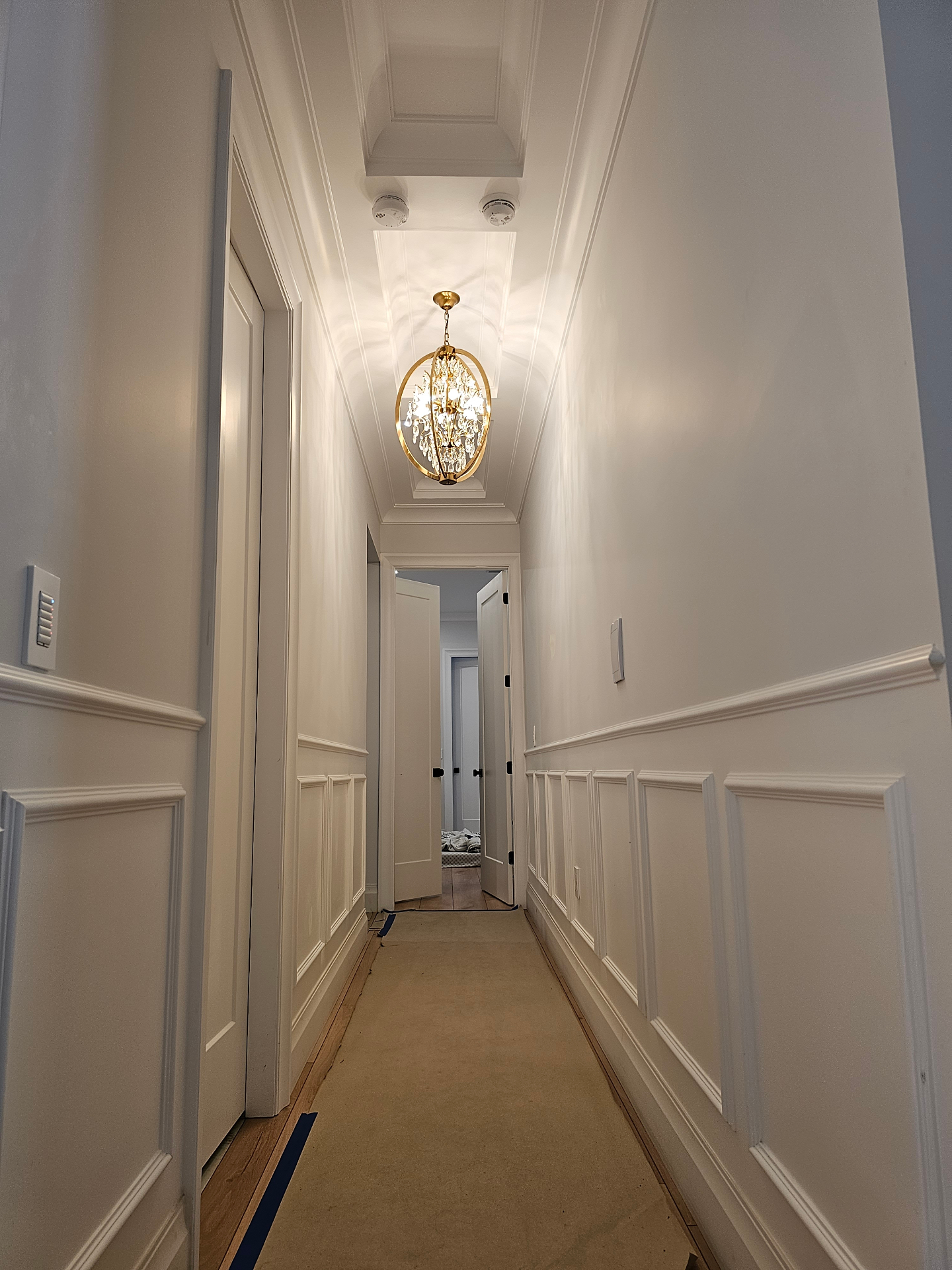Wall panelling and trim detail matched to kitchen cabinetry